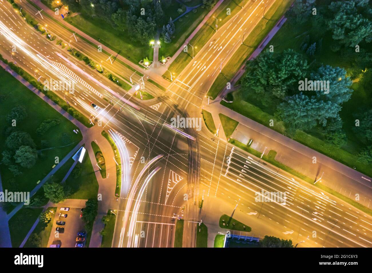 road intersection with car traffic at night city. aerial photography. Stock Photo