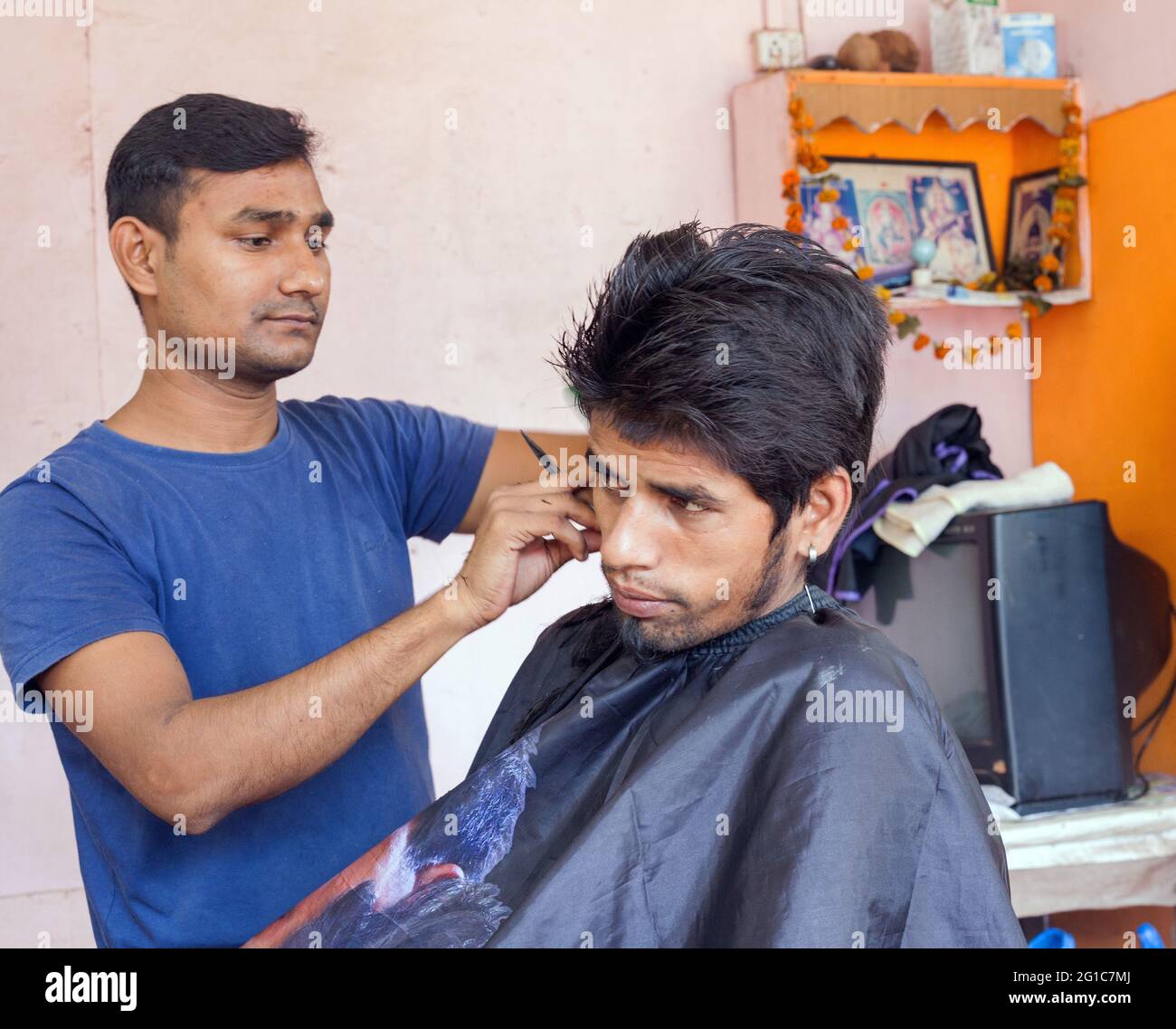 Indian male with bouffant hairstyle having his hair cut in salon Agonda  Goa India Stock Photo  Alamy