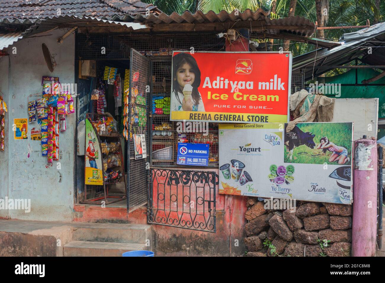 Exterior view of advertising and signage at local convenience store - Reema General Store, Agonda, Goa, India Stock Photo