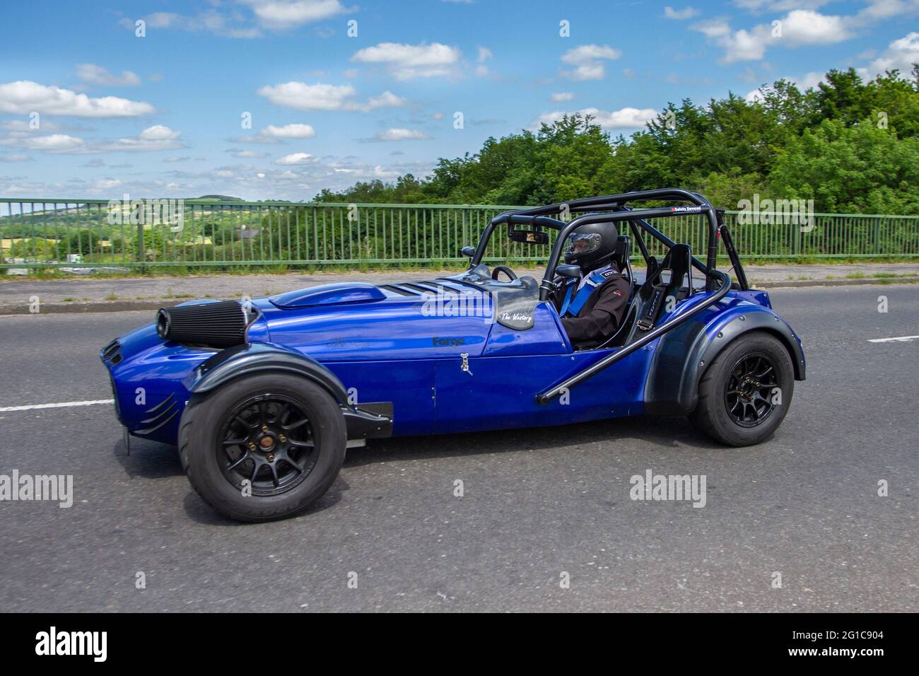 Westfield, compomotive Rotary Powered Forge blue kit car. 1995 90s blue Westfield. AIE Wankel Rotary Engine - 650S - 120HP SPARCS in Westfield 120R Vehicular traffic, moving vehicles, cars, vehicle driving on UK roads, motors, motoring on the M6 motorway highway UK road network. Stock Photo