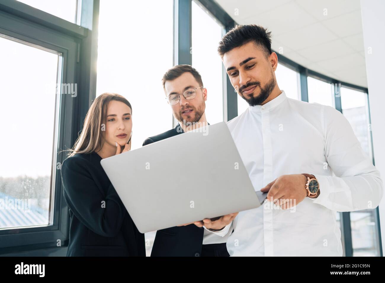 Group of software developers is thinking about  new project Stock Photo