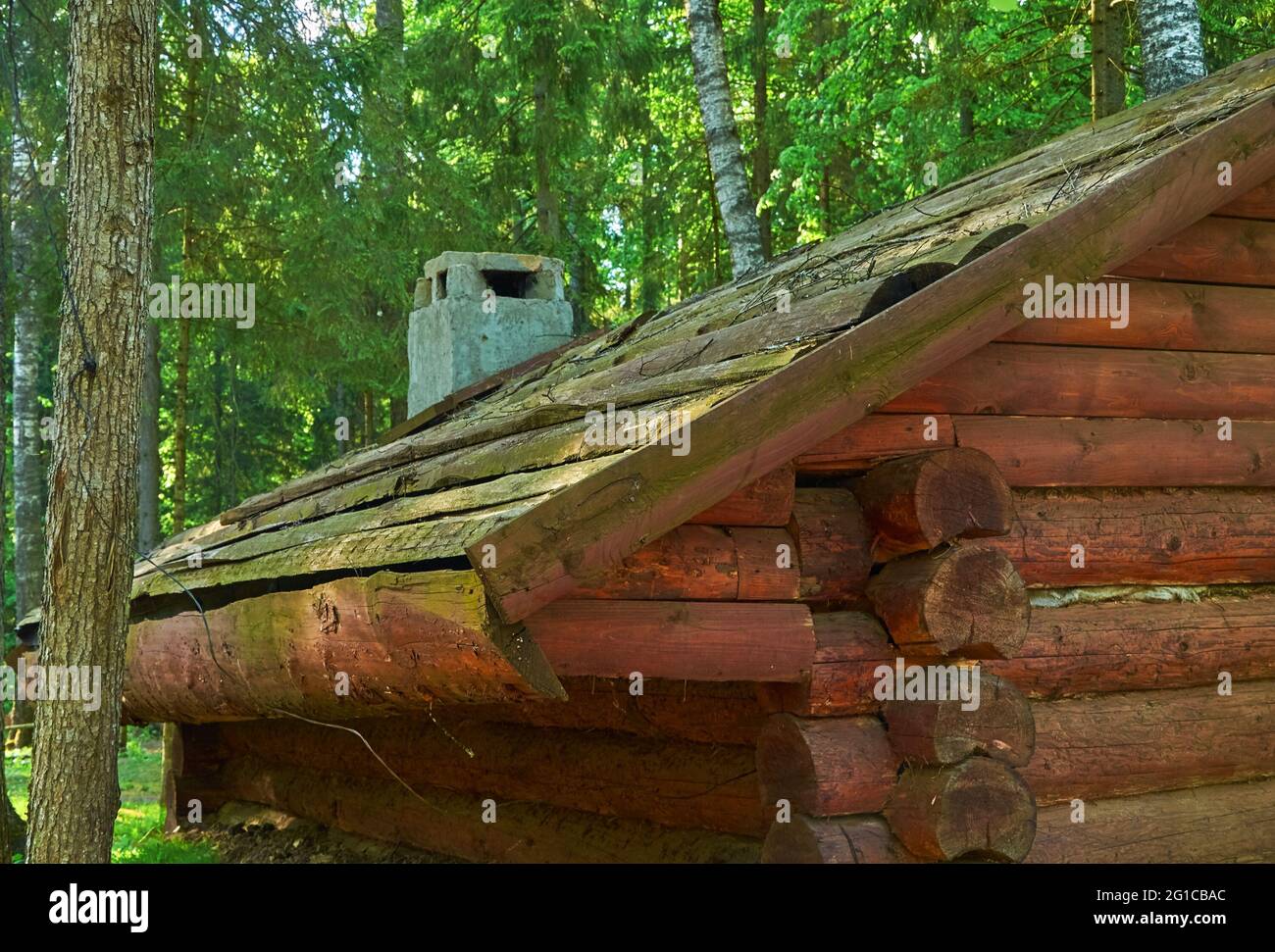 The roof of a wooden dugout with a brick chimney Stock Photo