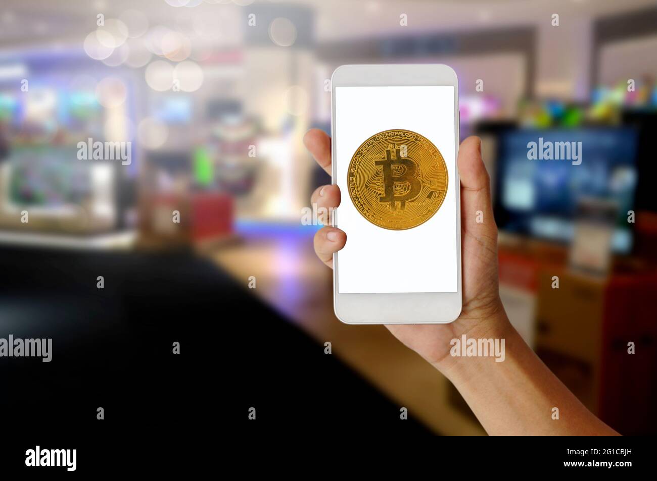 Hand holding phone with digital bitcoin cryptocurrency to pay, e-commerce  and blockchain concept Stock Photo - Alamy