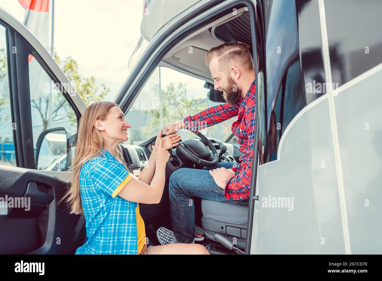 Man and woman testing a camper van or RV Stock Photo