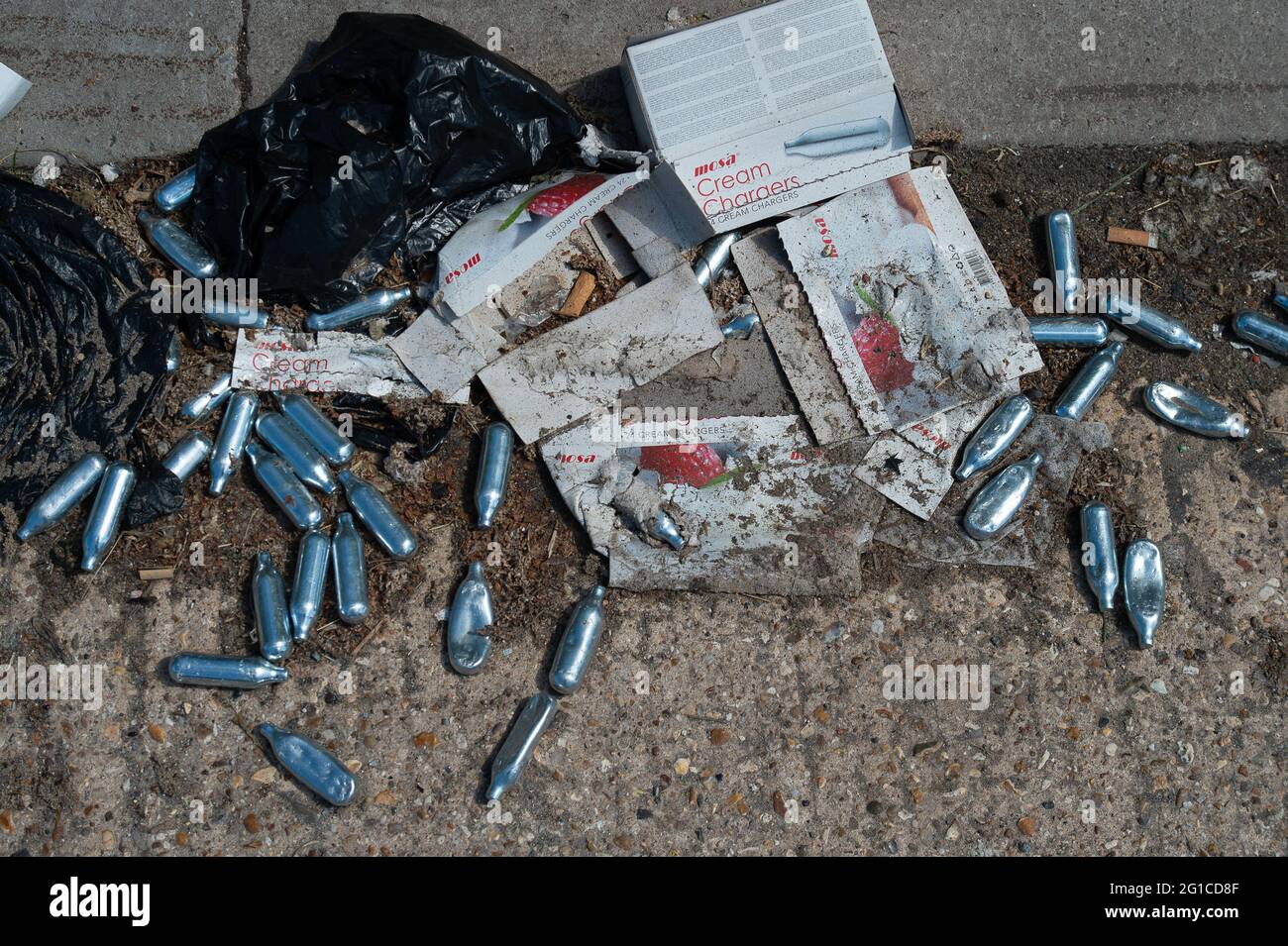 Discarded laughing gas cannisters balloons hires stock photography and