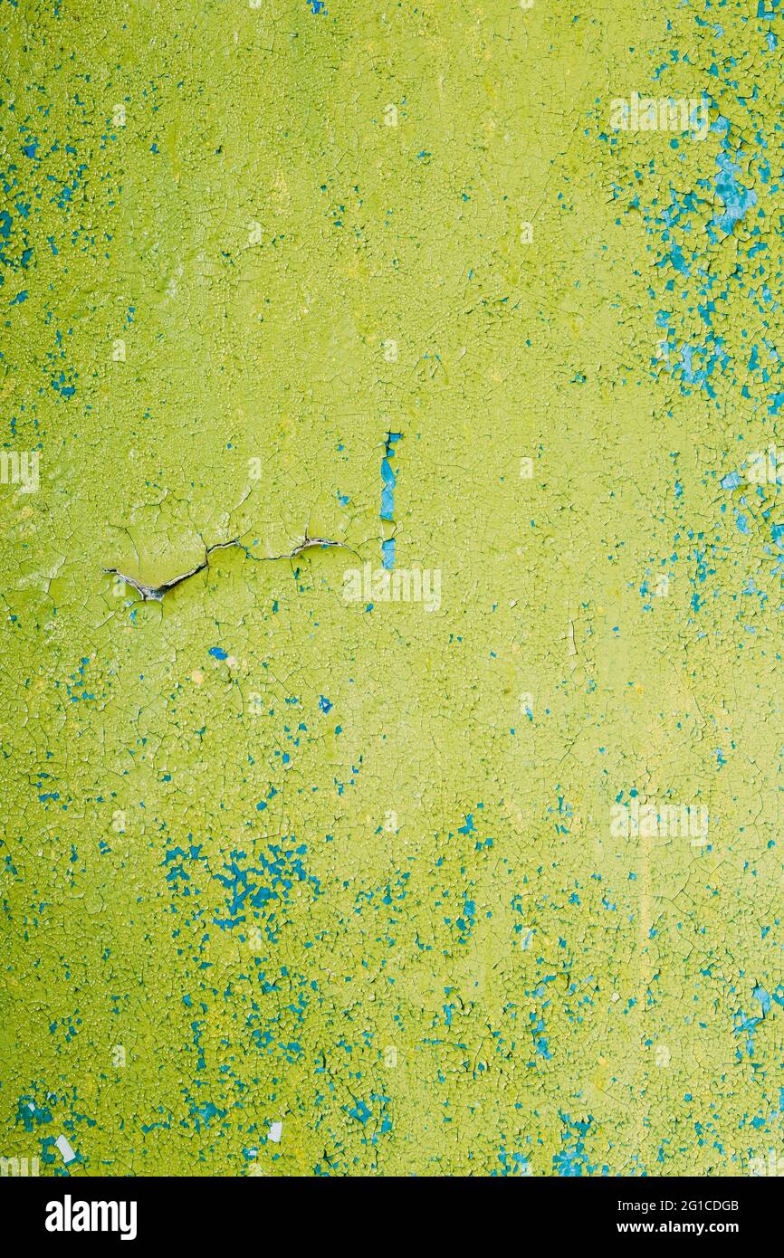 Close View Of Multilayer Dyed And Cracked Flaked Texture Of Blue And Light Green Paint At Surface. Stock Photo