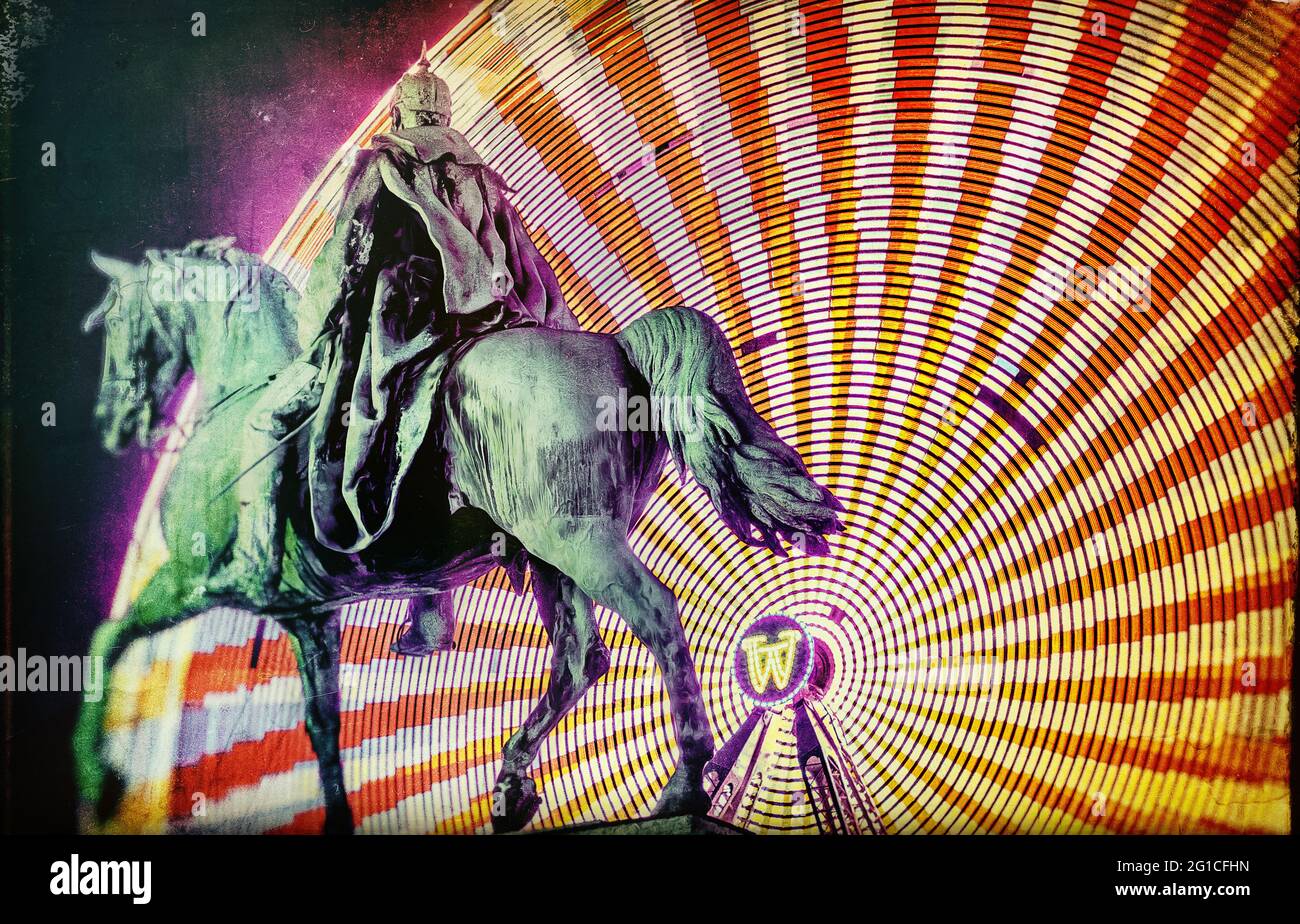 The Electric Rider - Kaiser Wilhelm I Monument in Essen city center at night. Ferris wheel monument memorial. Decoration and statue at night. Stock Photo