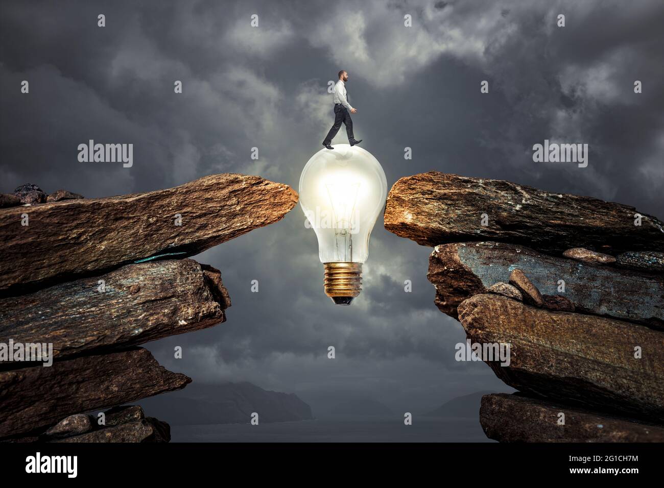 man crossing an obstacle thanks to an innovative idea. Stock Photo