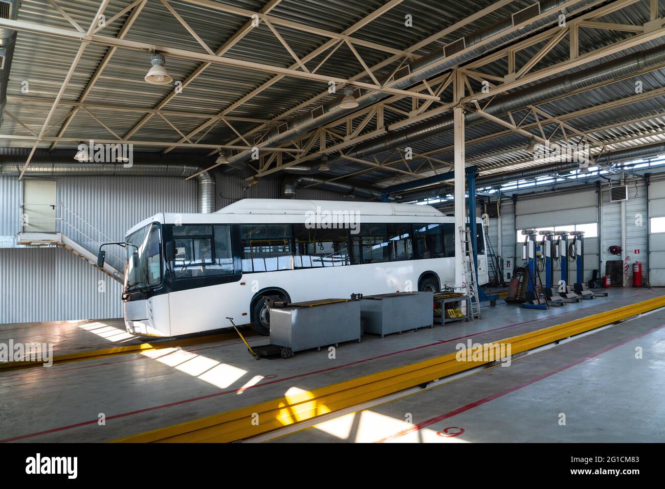 Bus repair service indoors Stock Photo Alamy