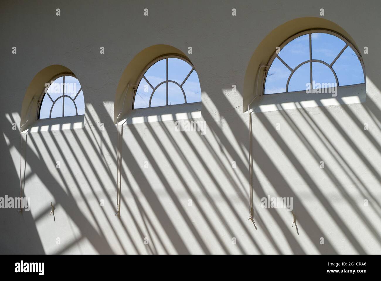 Windows and long shadows in the Orangery, Wrest Park, Silsoe, Bedfordshire, UK Stock Photo