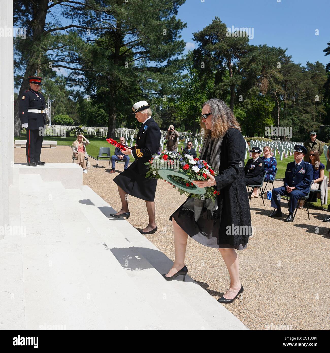 Memorial Day UK 2021 Mrs Caryn R. McClelland A/Deputy Charge d'Affairs of the US Embassy London with Commander Susan Lochner RN Deputy Lord Lieutenant of Surrey lay remembrance wreaths on the steps of the  Memorial Chapel at the American Military Cemetery, Brookwood Stock Photo