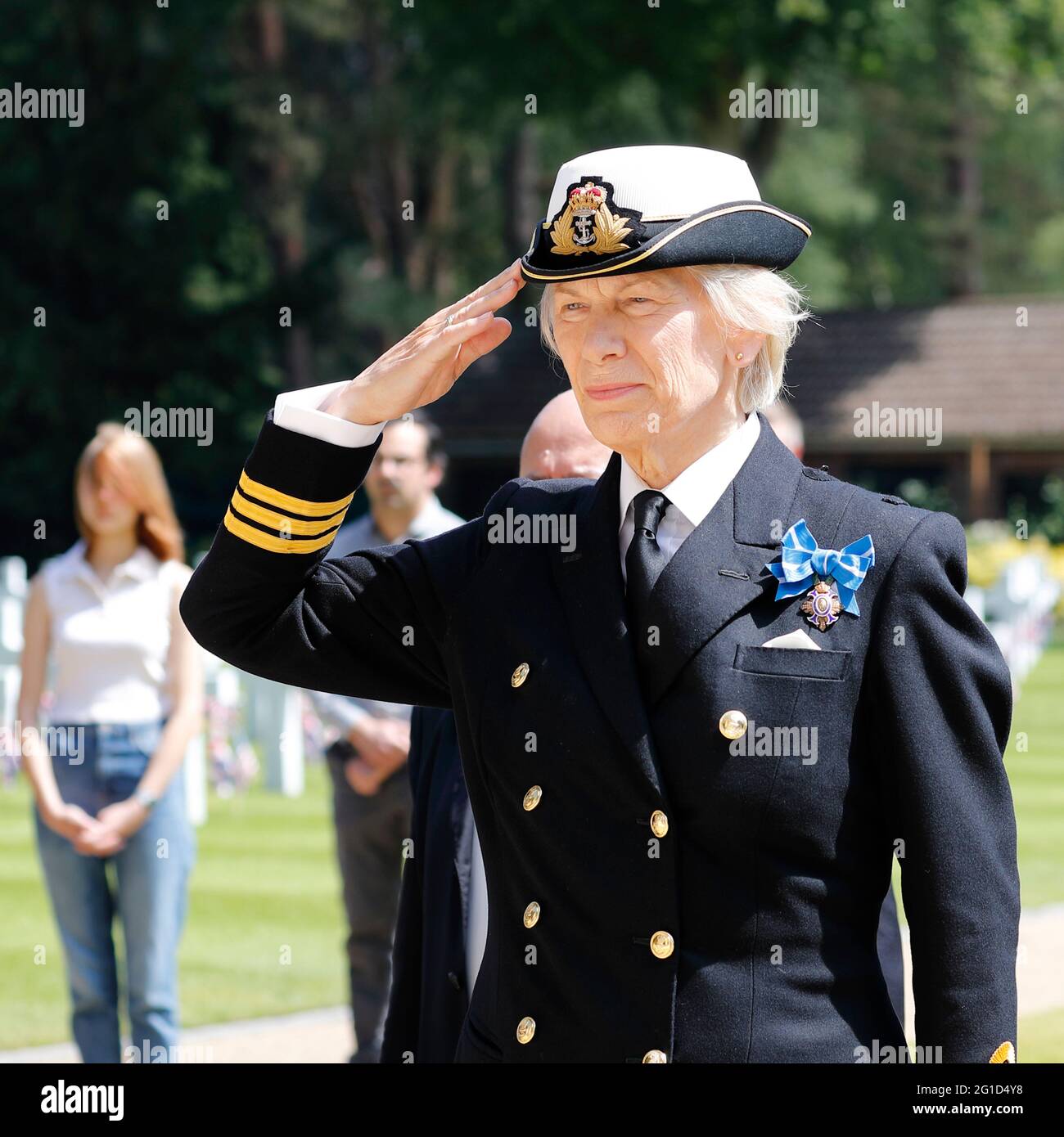 Memorial Day UK 2021 Deputy Lord Lieutenant of Surrey Commander Susan Lochner RN salutes while the National Anthem is heard Stock Photo