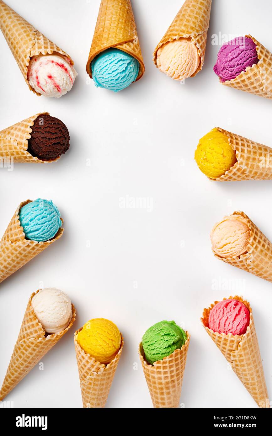 Assorted of ice cream in cones on white background. Colorful set of ice cream of different flavours. Ice cream isolated. Stock Photo
