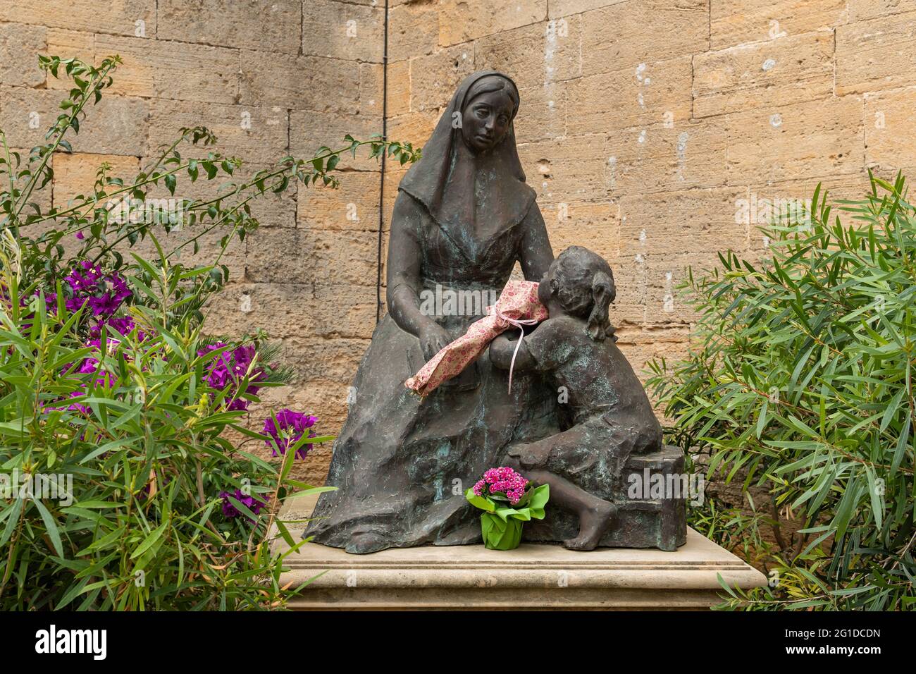 Campos, Spain; june 05 2021: Bronze sculpture by Sebastiana Llado i Sala, outside the church in the Majorcan town of Campos Stock Photo
