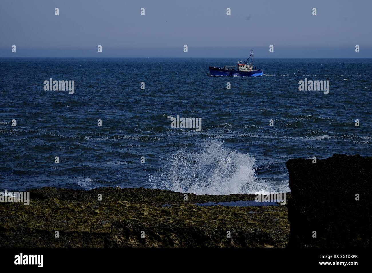 Fishing boat off Filey Brigg Stock Photo Alamy