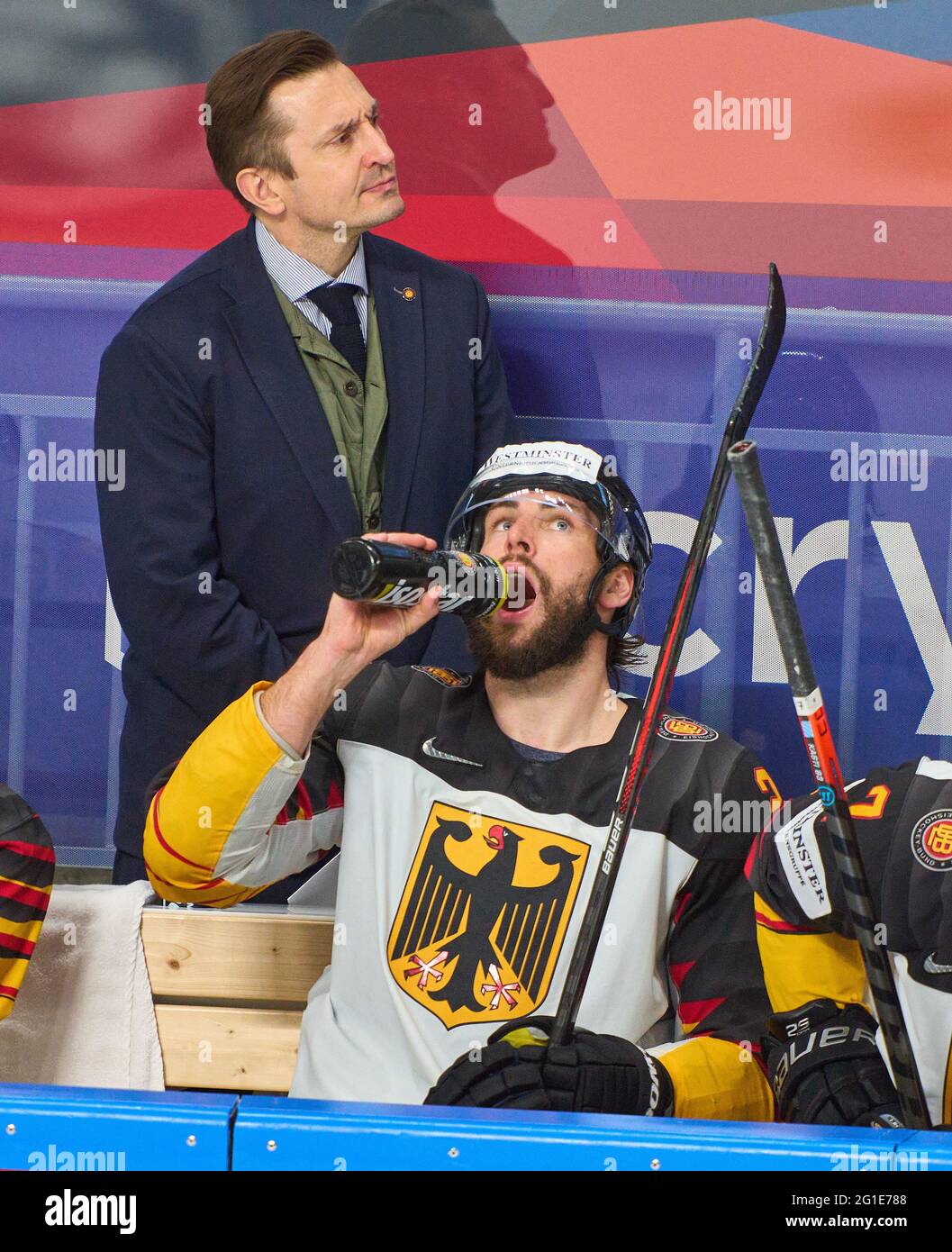 Riga, Latvia. 06th June, 2021. Ville PELTONEN, Matthias Plachta #22 of Germany drinks from water bottle, thirst, thirsty, liquid, thirst quencher, isotonic, nutrition, sports nutrition, electrolyte balance, wasser, trinken, getränk, USA - GERMANY 6-1 IIHF ICE HOCKEY WORLD CHAMPIONSHIPS Final for 3rd place in Riga, Latvia, Lettland, June 6, 2021, Season 2020/2021 Credit: Peter Schatz/Alamy Live News Stock Photo