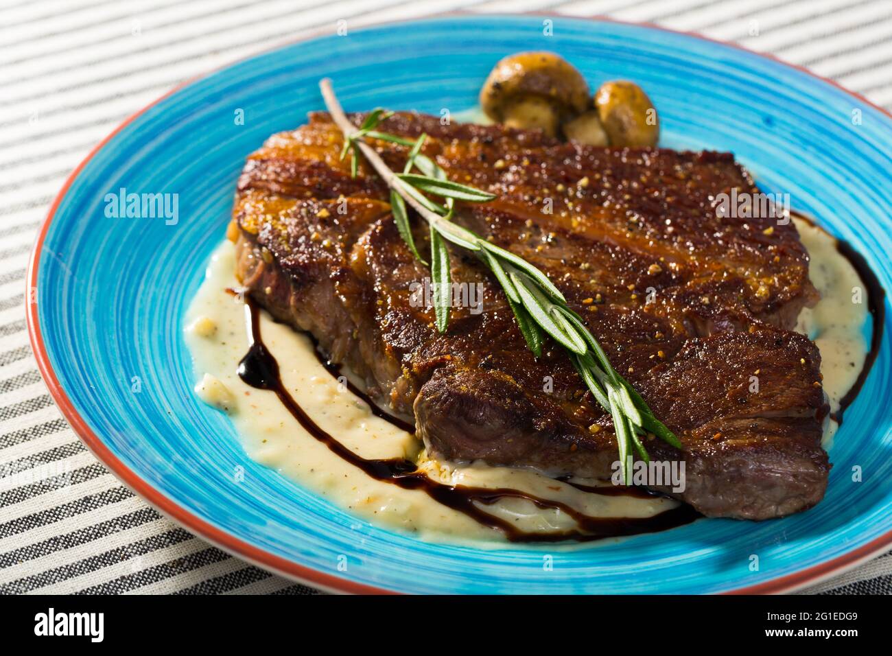 Grilled veal loin with mushroom sauce Stock Photo Alamy