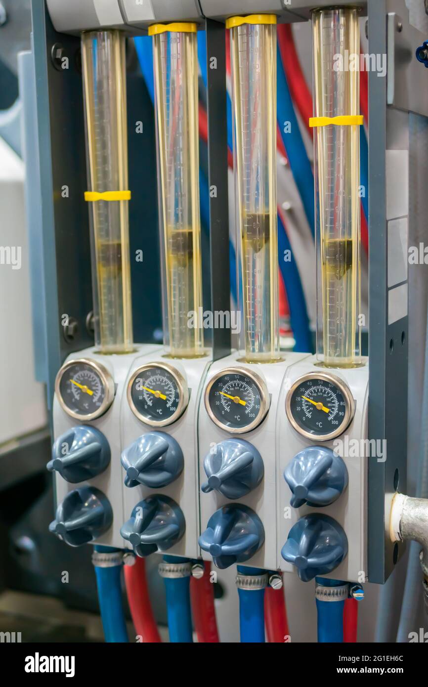 Flowmeter, rotameter - flow regulator for cooling system of injection machine Stock Photo