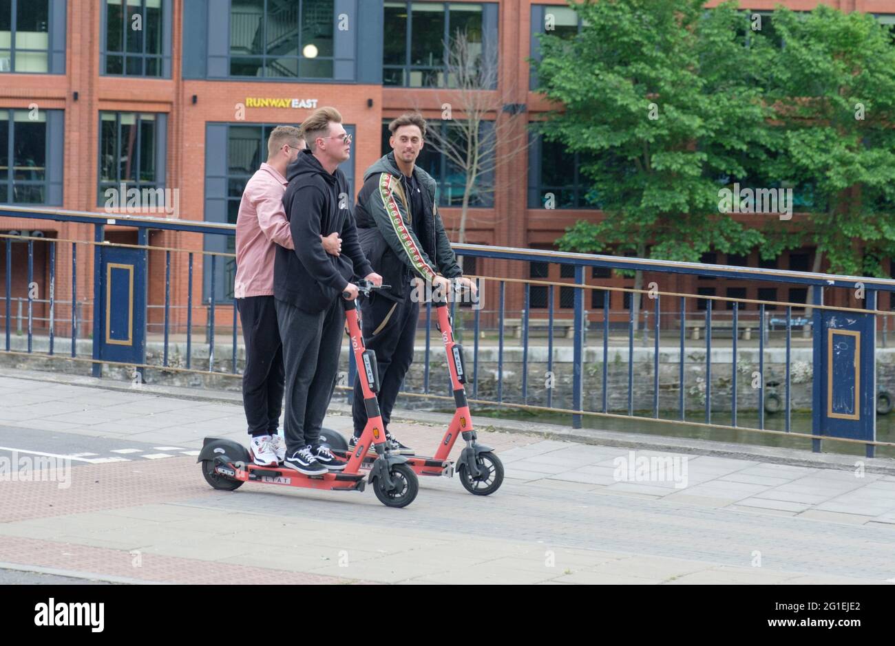 Young people riding Voi escooters in Bristol, UK Stock Photo Alamy