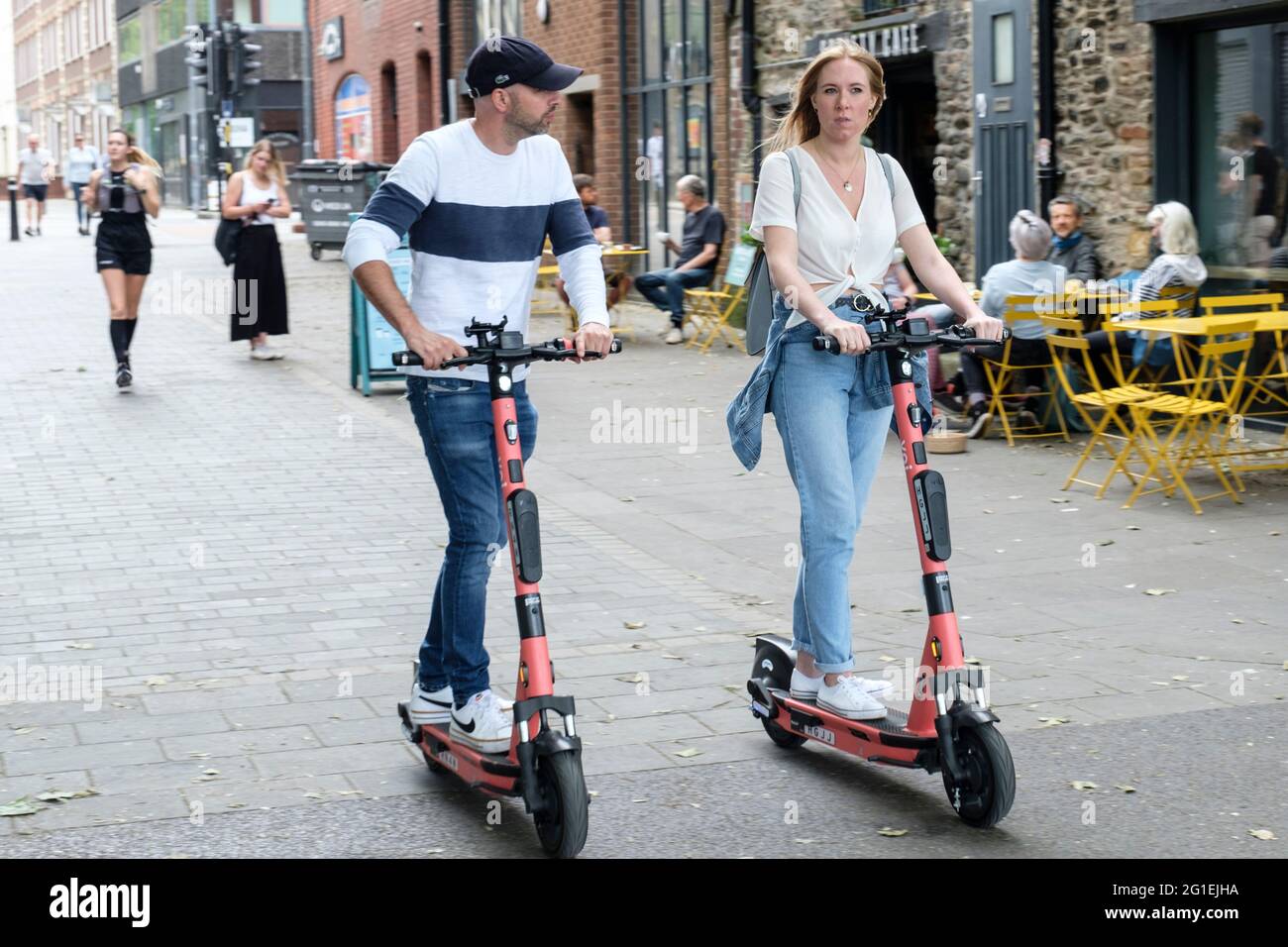Young people riding Voi escooters in Bristol, UK Stock Photo Alamy