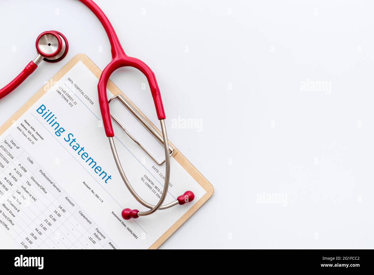 Medical billing statement with stethoscope. Top view Stock Photo