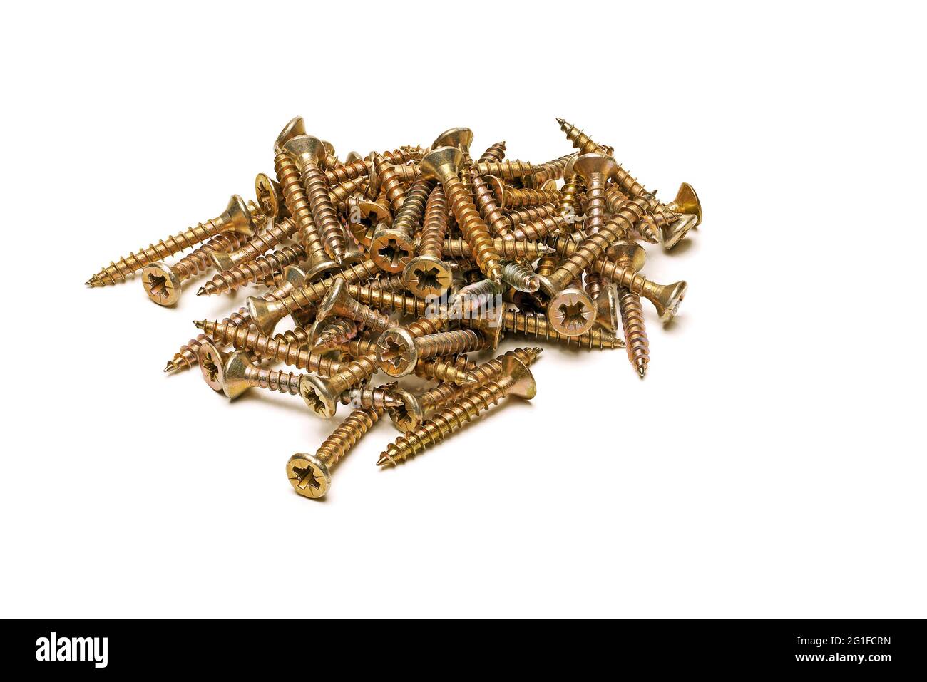 pile of yellow zinc plated screws isolated on white background, full