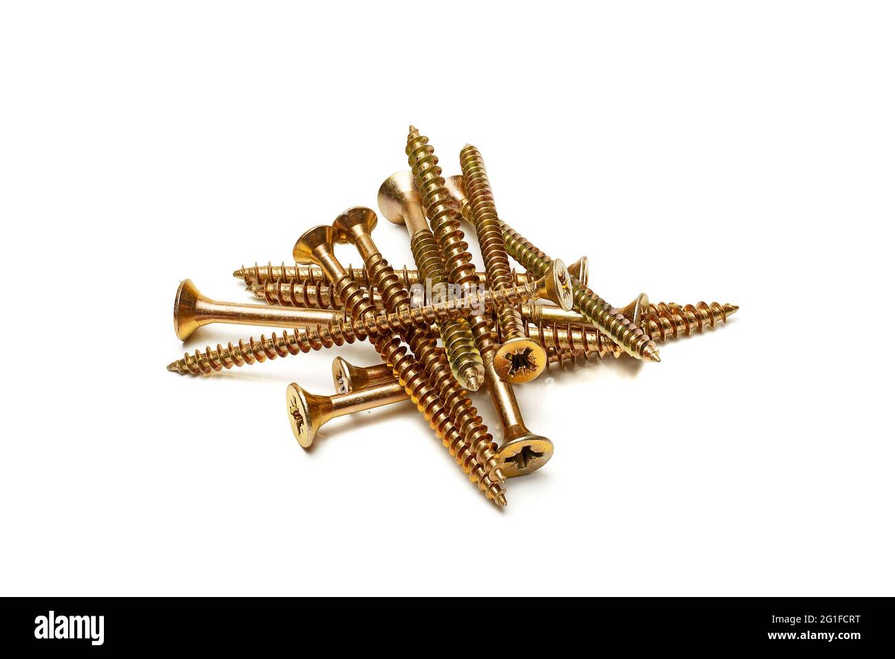 pile of yellow zinc plated screws isolated on white background, full