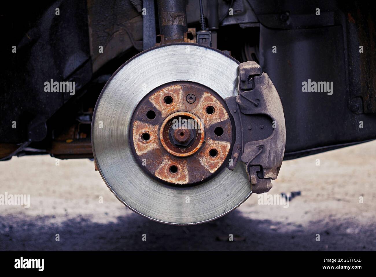 front view of used car disc brake with caliper, color graded Stock Photo