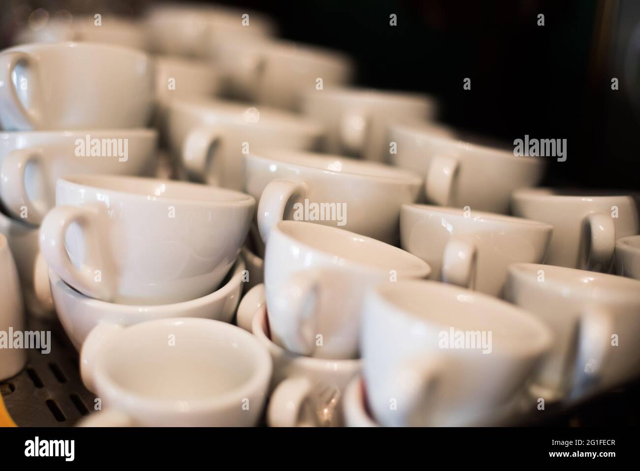 Close up shot of a stack of empty white coffee cups. Stock Photo