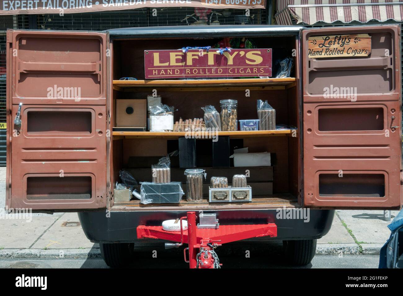 At a street fair in Astoria Queens, Lefty sells hand rolled cigars from
