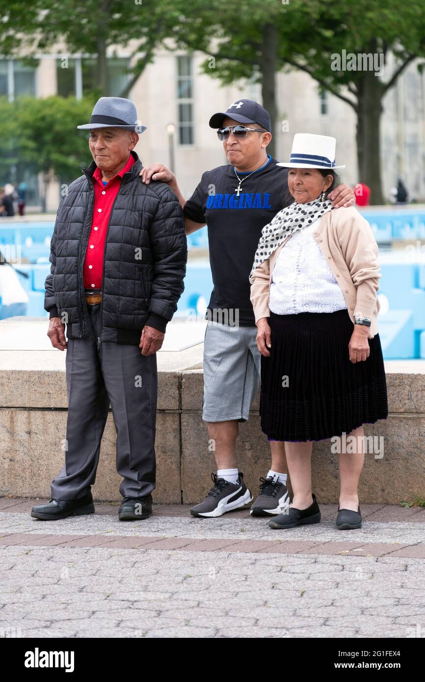 A Mexican American New Yorker poses for a photo with his parents who appear to be visiting. In Queens, New York City. Stock Photo