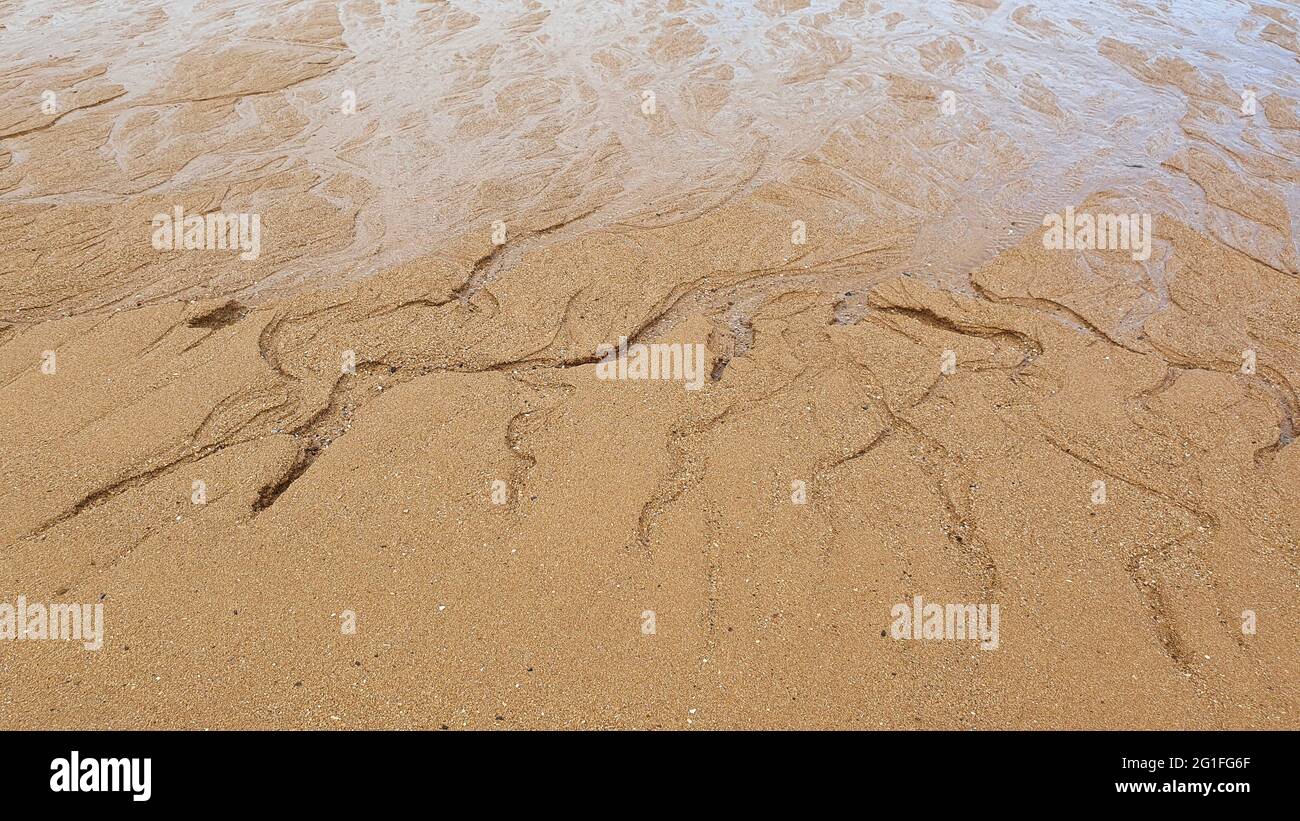Patterns in sand, shaped by sea Stock Photo - Alamy