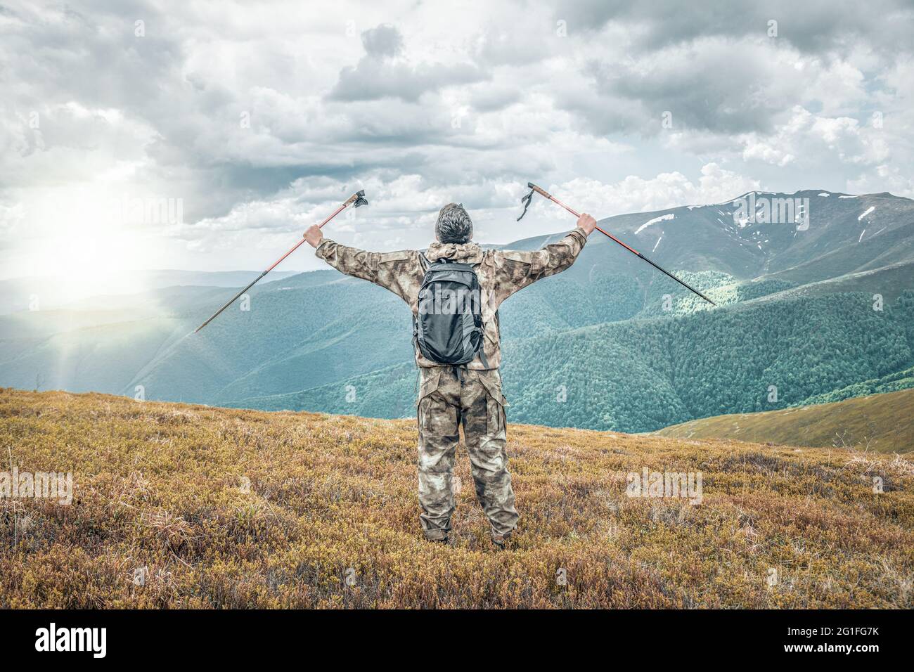 Happy man traveler hands raised hi-res stock photography and images - Alamy
