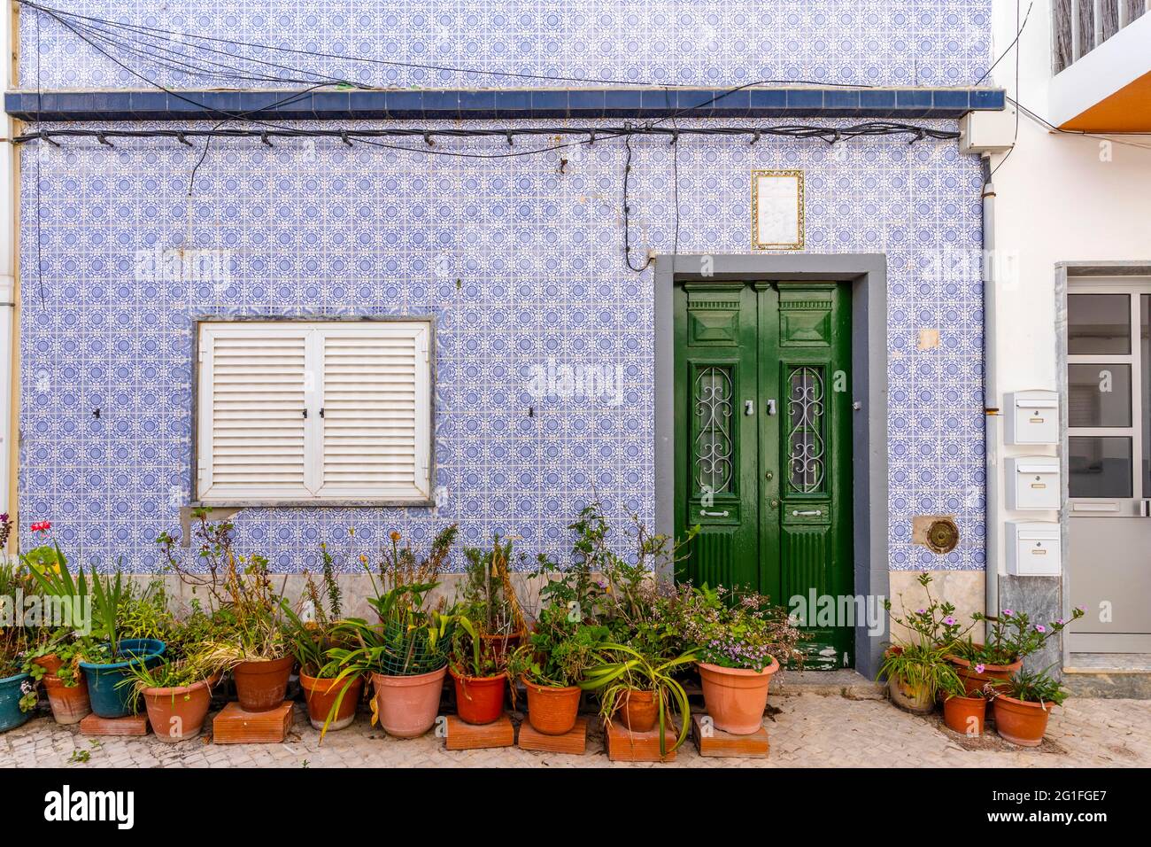 A house with traditional Portuguese tiles in Olhao, Algarve, Portugal Stock Photo