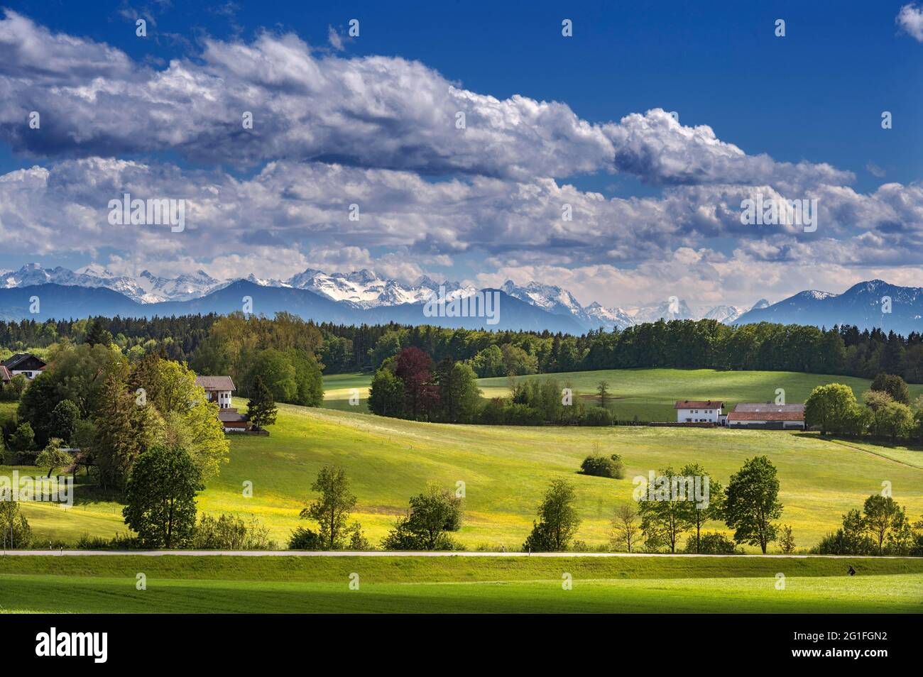 Springlike landscape in the foothills of the Alps with (cumulus) clouds, near Deining, Upper Bavaria, Bavaria, Germany Stock Photo