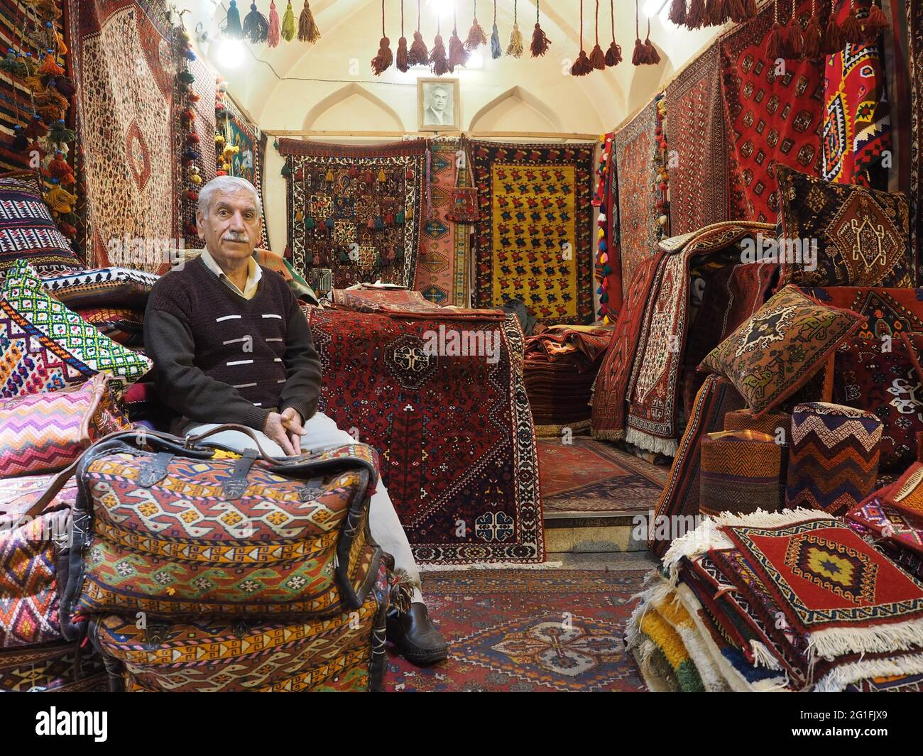 Carpet seller in Vakil Bazaar, Shiraz, Iran Stock Photo