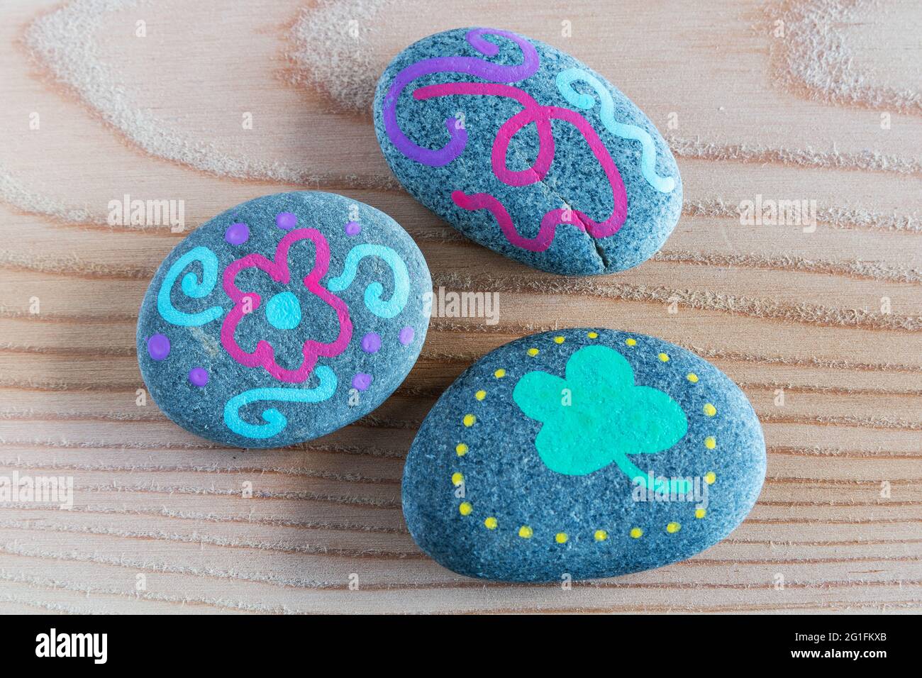 Stones painted with markers Stock Photo - Alamy