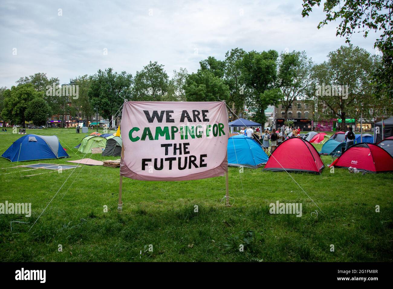 'We are camping for the future' - Signage at a freedom protest camp on Shepherd's Bush Green, London, UK. June 2021 Stock Photo