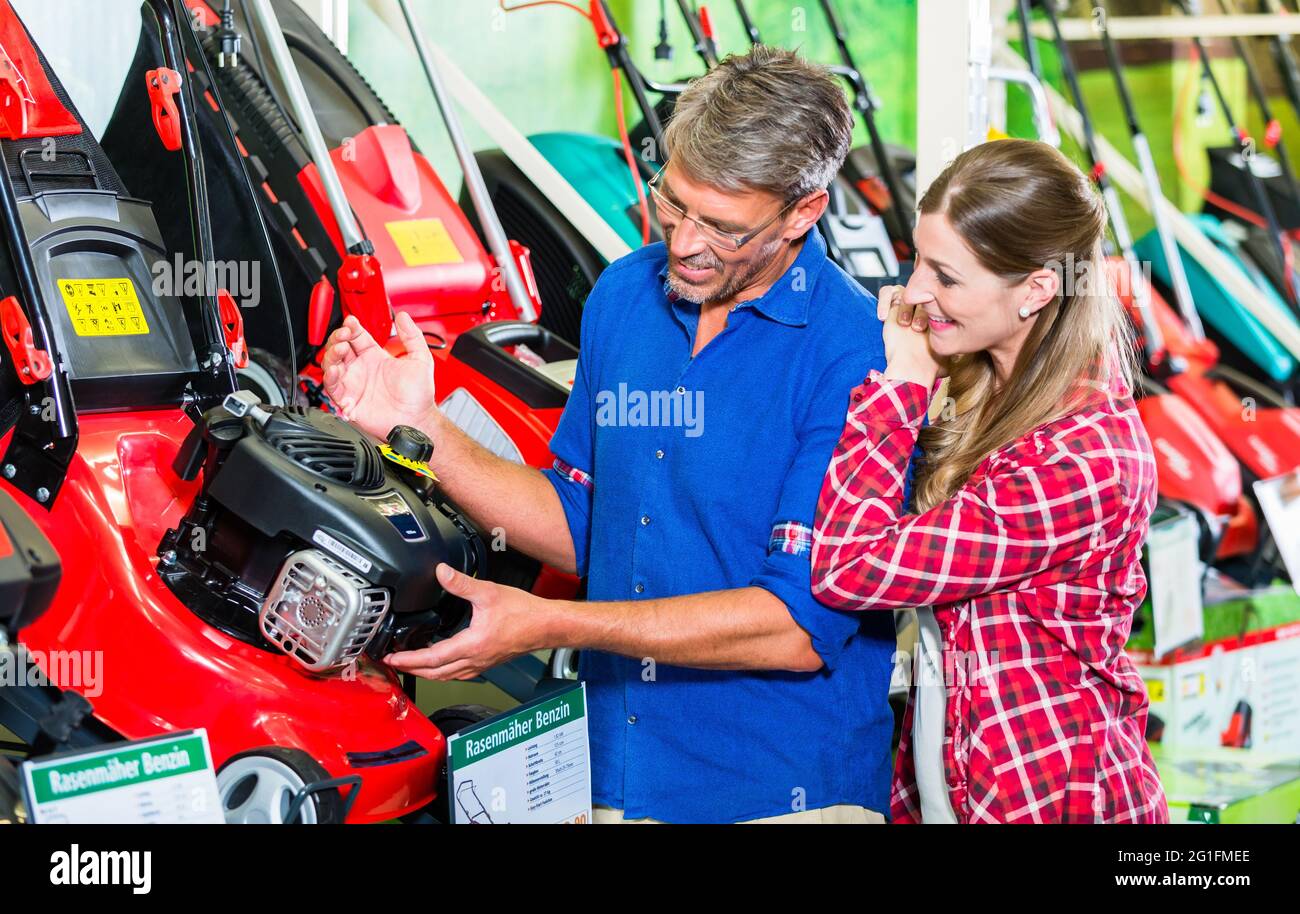Hobby gardener couple, woman and man, in garden center of hardware