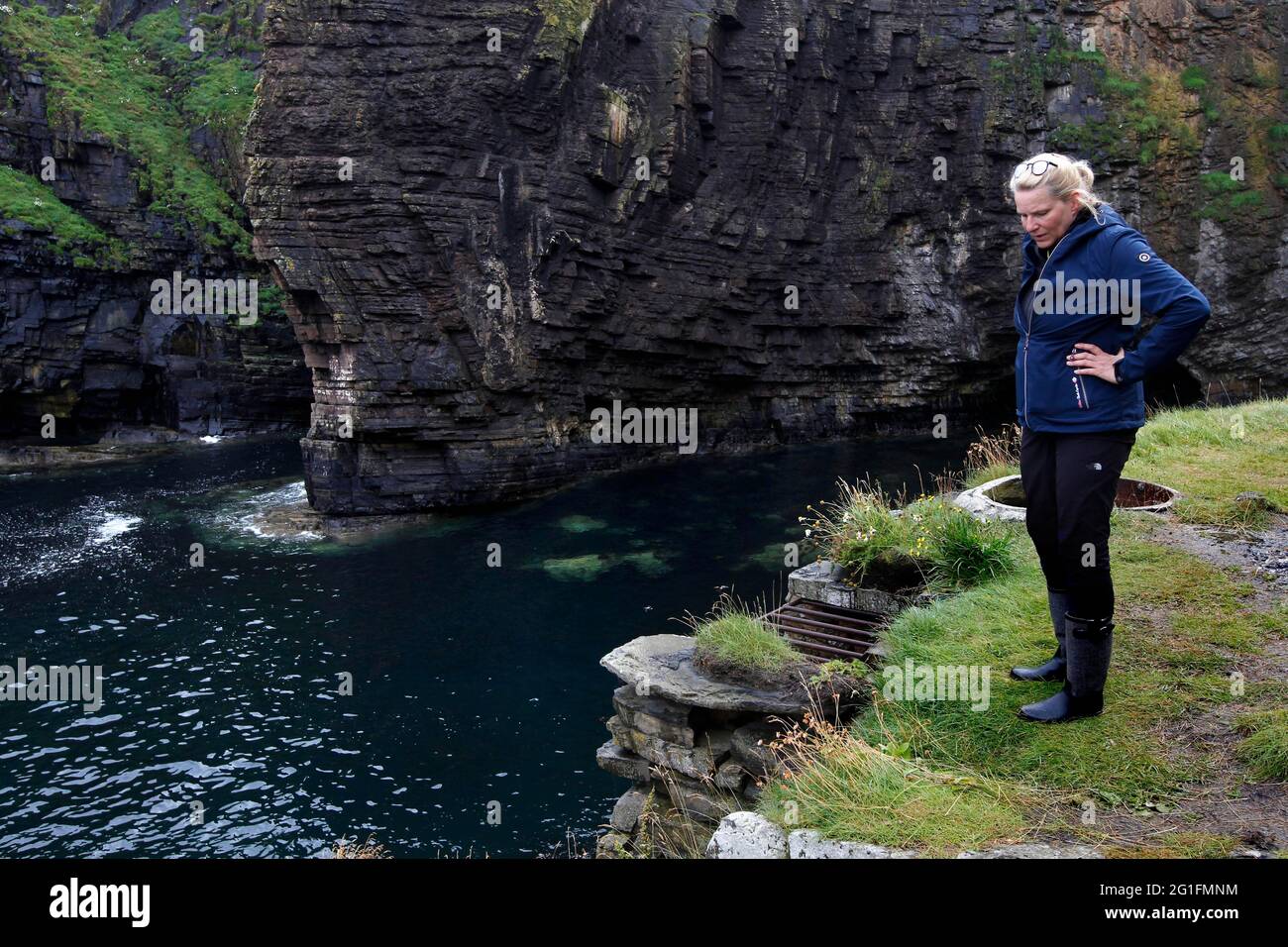 Cliff, Rocky coast, Woman, Whaligoe Steps, Wick, North east coast, Highlands, Highland, Scotland, Great Britain Stock Photo