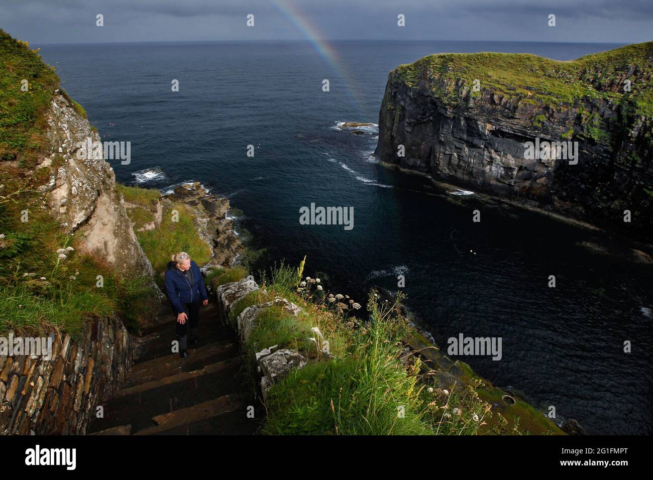 Steps, Stairs, Cliff, Rocky coast, Woman, Whaligoe Steps, Wick, North east coast, Highlands, Highland, Scotland, Great Britain Stock Photo
