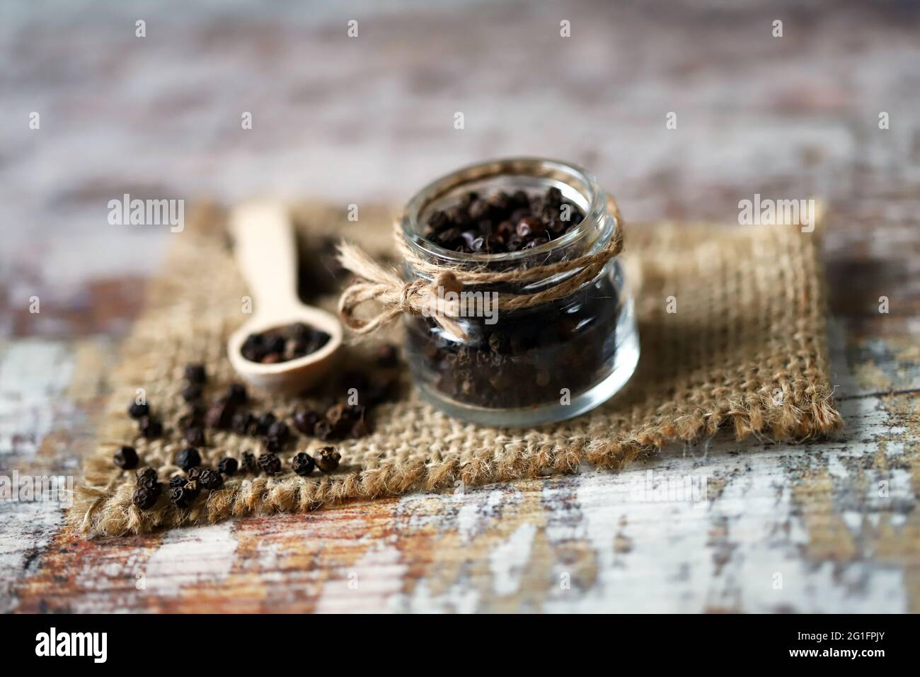 Black peppercorns in a jar. Copy space Stock Photo Alamy