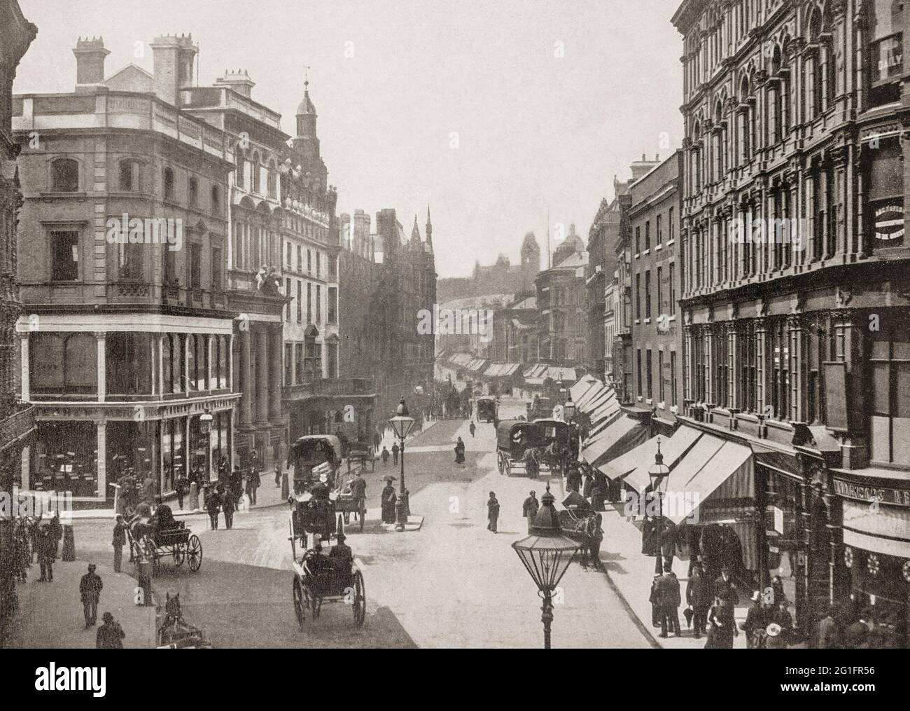 A late 19th century view of New Street in central Birmingham, England. It is one of the city's principal thoroughfares and shopping streets linking Victoria Square to the Bullring. It gives its name to New Street railway station, although the station never had direct access to New Street except via  Stephenson Street. Stock Photo