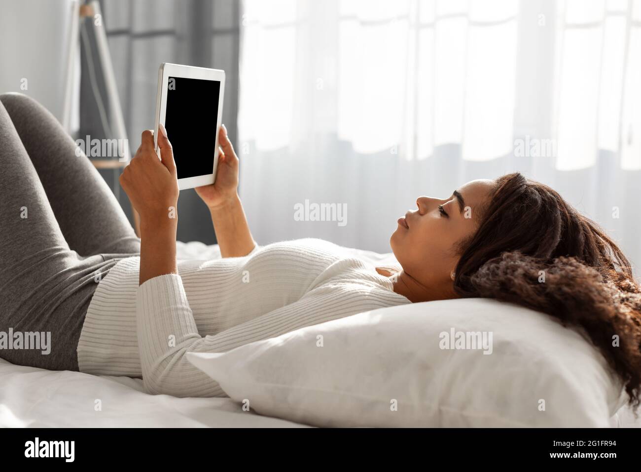 African American person holding tablet with blank empty screen Stock ...