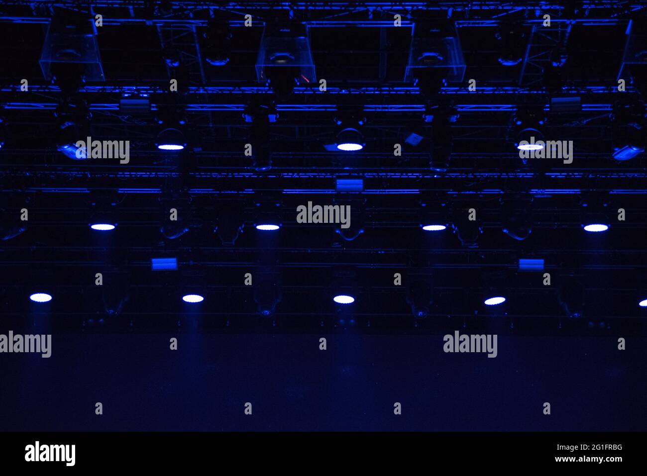 Stage lights glowing in the dark. Live music festival concept background Stock Photo