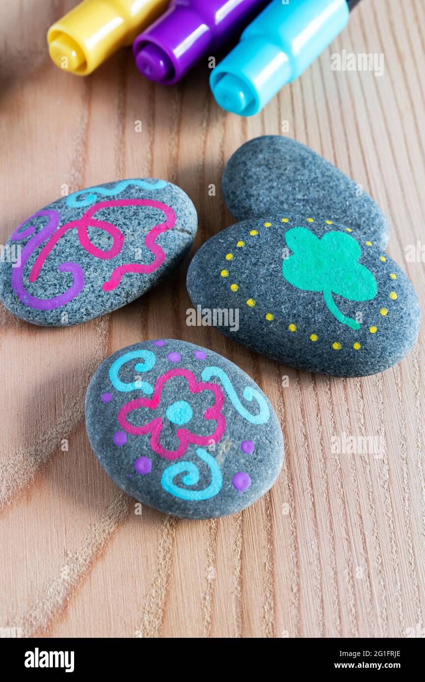 Stones painted with markers Stock Photo - Alamy