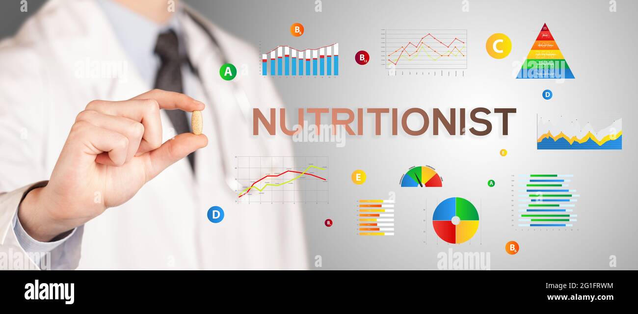 Nutritionist giving you a pill Stock Photo