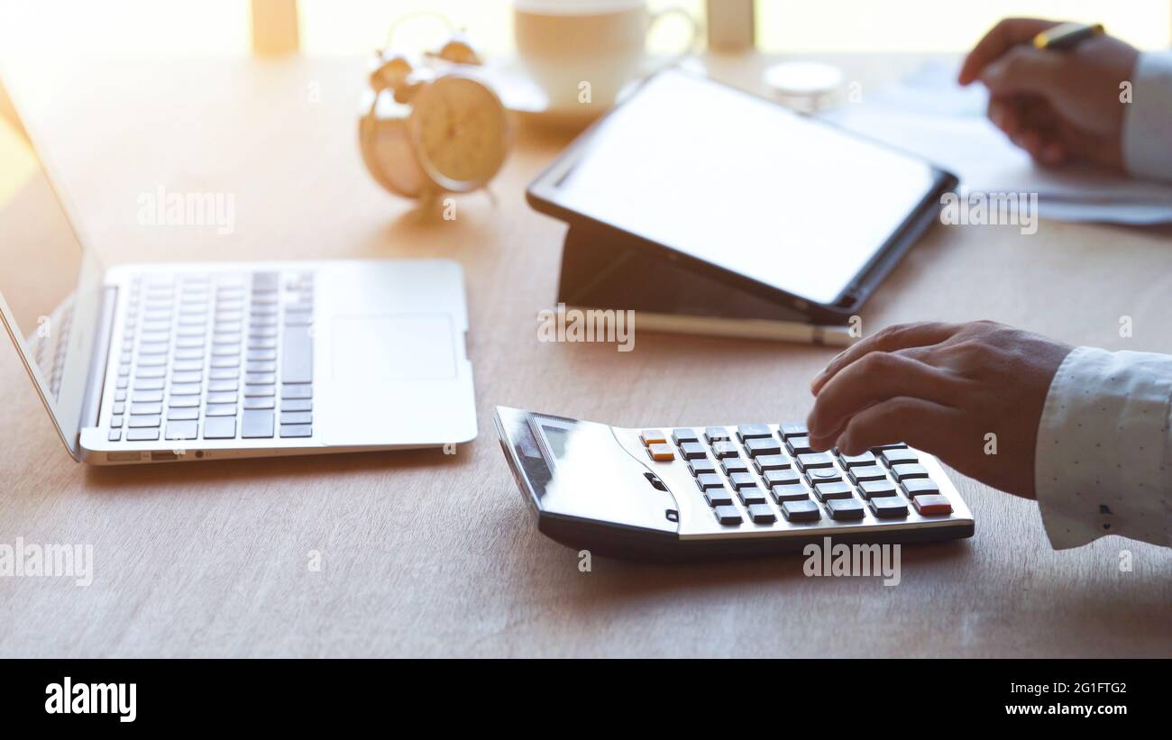 Man calculating tax hi-res stock photography and images - Alamy