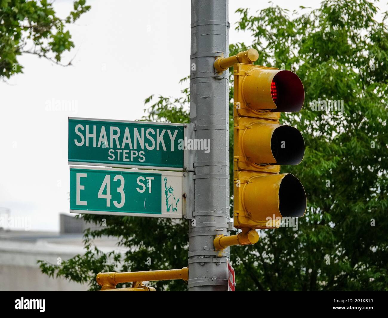 Street signs for Sharansky Steps and East 43rd Street at the edge of the Tudor City historic district, Manhattan, New York, NY, USA. Stock Photo