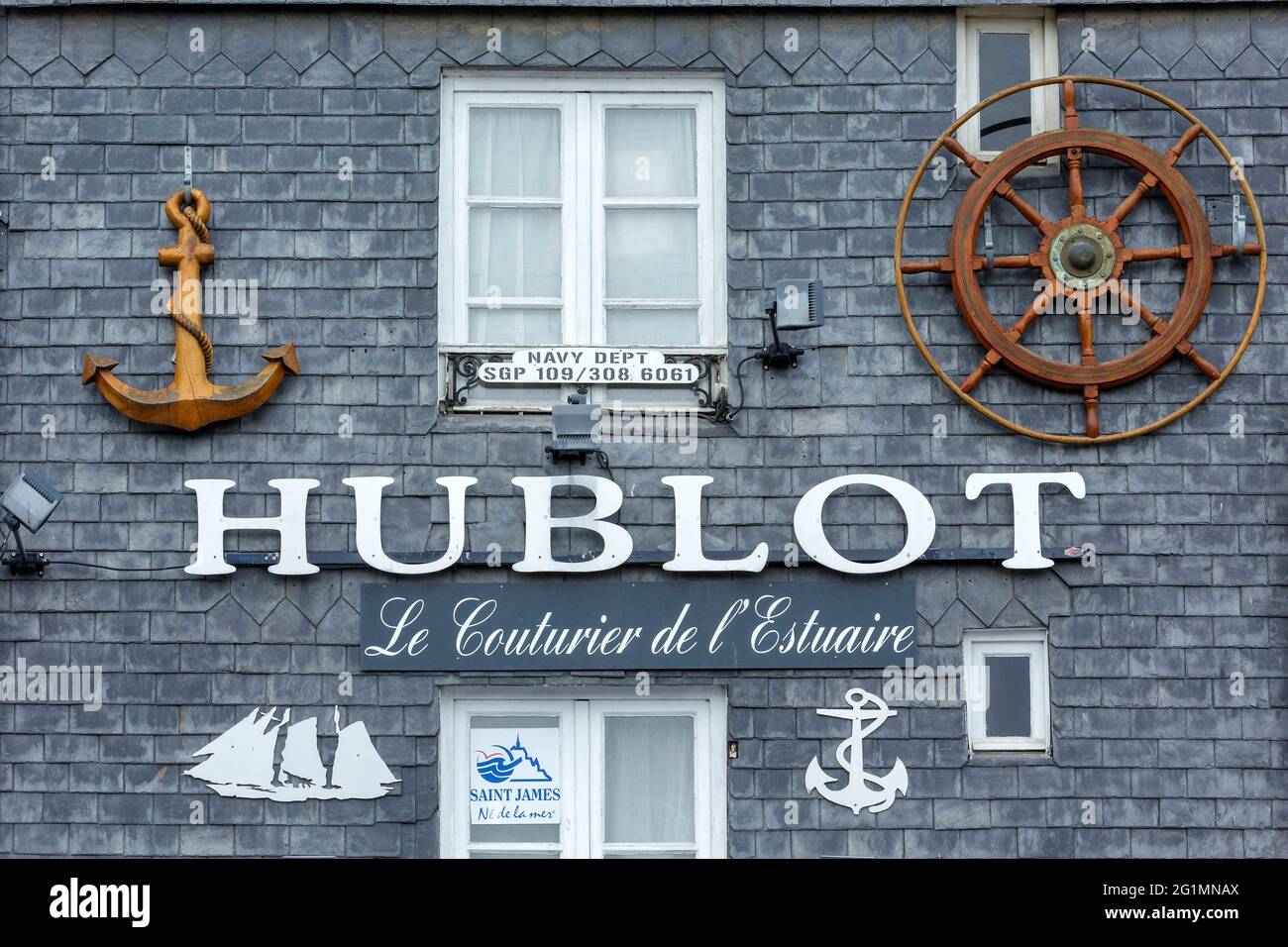 France, Calvados, estuary of the Seine, Pays d'Auge, Honfleur, detail of the facade of a traditional house and sign of shop nearby Quai Saint Etienne (Saint Etienne quay) Stock Photo